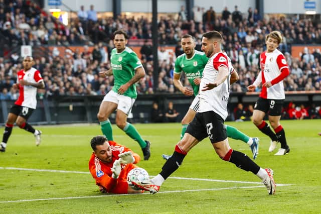 PEC Zwolle goalkeeper Jasper Schendelaar challenges Feyenoord's Luka Ivanusec  in May 2024. Picture: BART STOUTJESDIJK/ANP/AFP via Getty Images