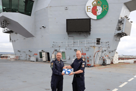 Battleplans have been drawn up between the Royal Navy and Nato. Pictured: Italys Rear Admiral Andrea Petroni receives the task group standard from Rear Adm Rob Pedre