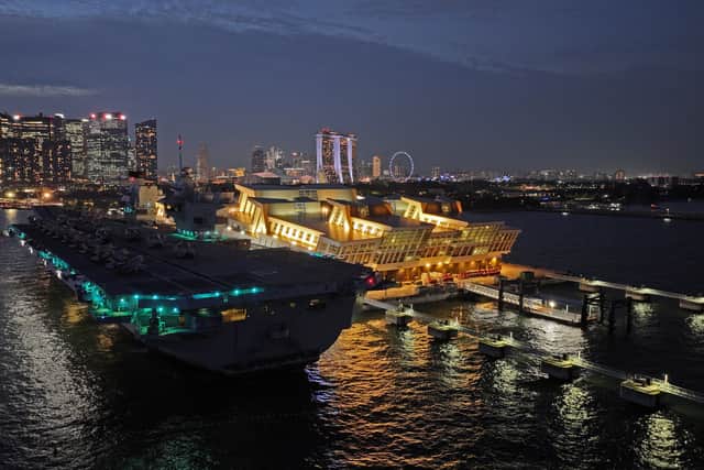 HMS Prince of Wales has left Singapore and is heading towards Australia for Exercise Talisman Sabre, where Royal Navy and RAF personnel will join other international allies. Pictured if the aircraft carrier seen at night docked in the Port of Singapore on June 25, 2025.