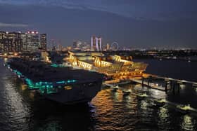 HMS Prince of Wales has left Singapore and is heading towards Australia for Exercise Talisman Sabre, where Royal Navy and RAF personnel will join other international allies. Pictured if the aircraft carrier seen at night docked in the Port of Singapore on June 25, 2025.
