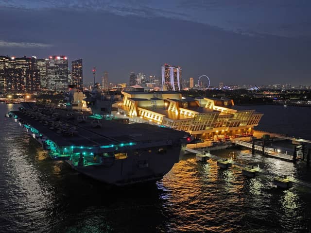 HMS Prince of Wales has left Singapore and is heading towards Australia for Exercise Talisman Sabre, where Royal Navy and RAF personnel will join other international allies. Pictured if the aircraft carrier seen at night docked in the Port of Singapore on June 25, 2025.