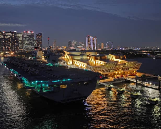 HMS Prince of Wales has left Singapore and is heading towards Australia for Exercise Talisman Sabre, where Royal Navy and RAF personnel will join other international allies. Pictured if the aircraft carrier seen at night docked in the Port of Singapore on June 25, 2025.