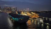 HMS Prince of Wales has left Singapore and is heading towards Australia for Exercise Talisman Sabre, where Royal Navy and RAF personnel will join other international allies. Pictured if the aircraft carrier seen at night docked in the Port of Singapore on June 25, 2025.