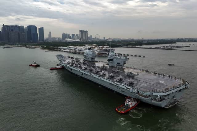 HMS Prince of Wales is at the helm of the UK Carrier Strike Group. Pictured: The Royal Navy flagship arriving at the Port of Singapore on June 23.