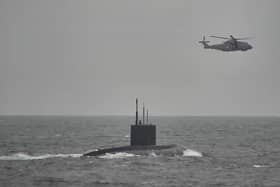HMS Mersey and Royal Navy helicopters stalked the Russian submarine RFN Novorossiysk as it sailed through British waters.
