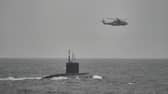 HMS Mersey and Royal Navy helicopters stalked the Russian submarine RFN Novorossiysk as it sailed through British waters.