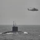 HMS Mersey and Royal Navy helicopters stalked the Russian submarine RFN Novorossiysk as it sailed through British waters.