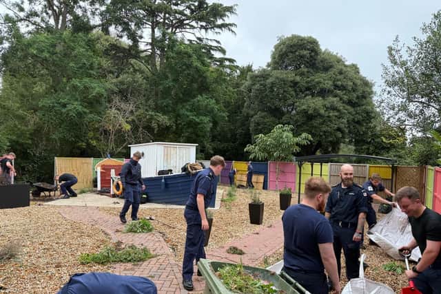 Naval personnel clear the gardens at the Royal Naval Benevolent Trusts Admiral Jellicoe House in Southsea.