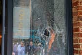 One of the smashed windows at Farm Kitchen in Palmerston Road.