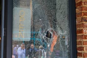 One of the smashed windows at Farm Kitchen in Palmerston Road.