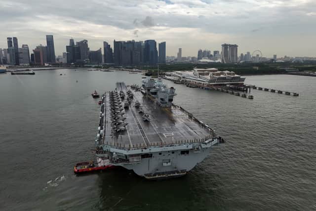 The former First Sea Lord has responded to reports that a USA Pentagon policy chief called for HMS Prince of Wales to go home from her Indo-Pacific deployment. Pictured: The Royal Navy flagships arriving at the Port of Singapore in June.
