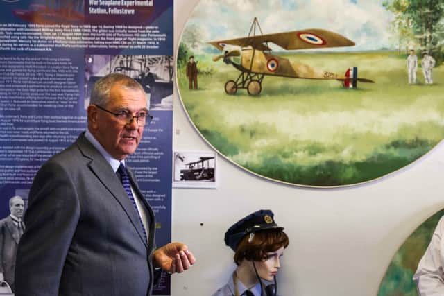 Maurice Oliver, curator of the Air Museum, surrounded by exhibits chronicling Gosport's remarkable aviation history
