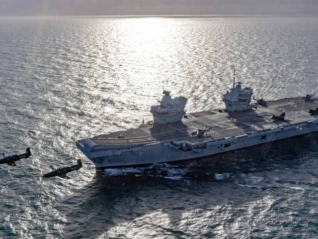 HMS Queen Elizabeth will be sailing to Rosyth in Scotland for significant upgrades and a major overhaul to be carried out. Pictured: The Royal Navy aircraft carrier on Exercise Faraday Field in the Irish sea near Anglesey, RAF Valley with a brace of Texan T1's flying over. 