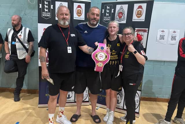 Poppy Cooper with her Leigh Park coaches after Ringside Trust Box Cup victory.