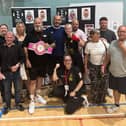 Poppy Cooper with her Leigh Park coaches and famil after  Ringside Trust Box Cup victory.