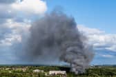 Smoke caused by a fire billows above the site of the Tomorrowland electronic music festival in Boom, northern Belgium on July 16, 2025.