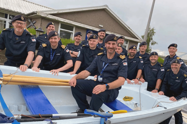 Senior Naval Officer Cdr Chris Cozens with his crew of HMS Venturer.