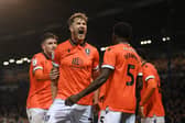 Michael Smith celebrates his goal against Pompey at Fratton Park last season