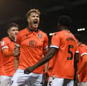 Michael Smith celebrates his goal against Pompey at Fratton Park last season