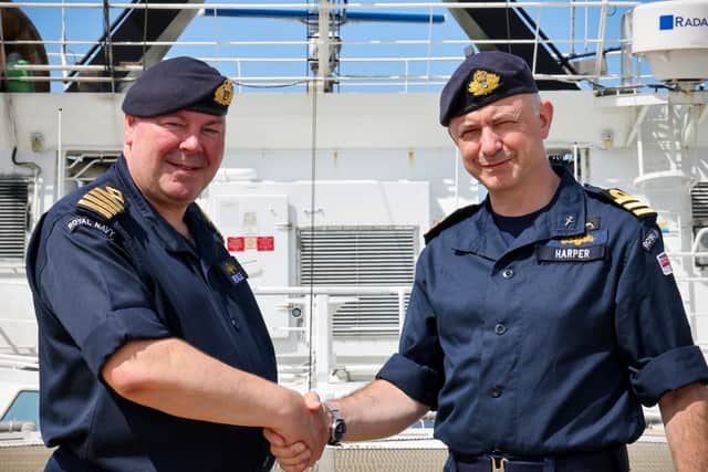 The current Commanding Officer Captain Reville RFA hand over to Commander Harper RN.