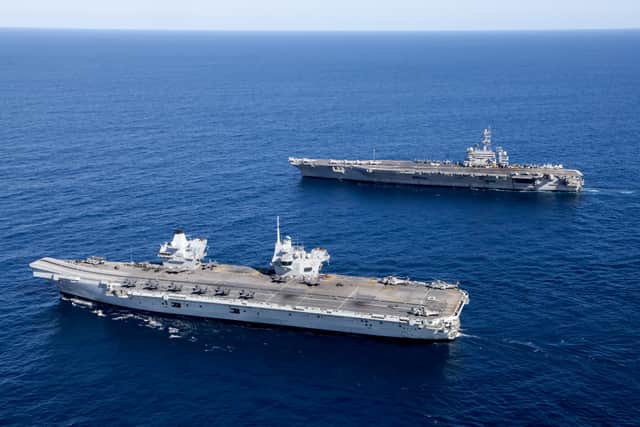 HMS Prince of Wales completed Exercise Talisman Sabre off the coast of Australia with her carrier strike group, joining forces with American sailors. Pictured Top to Bottom: United States Aircraft Carrier, USS George Washington and UK Aircraft Carrier, HMS Prince of Wales.