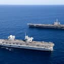 HMS Prince of Wales completed Exercise Talisman Sabre off the coast of Australia with her carrier strike group, joining forces with American sailors. Pictured Top to Bottom: United States Aircraft Carrier, USS George Washington and UK Aircraft Carrier, HMS Prince of Wales.