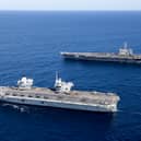 HMS Prince of Wales completed Exercise Talisman Sabre off the coast of Australia with her carrier strike group, joining forces with American sailors. Pictured Top to Bottom: United States Aircraft Carrier, USS George Washington and UK Aircraft Carrier, HMS Prince of Wales.