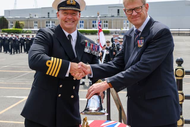 VIP Captain Dave Burrell RN presenting Triumphs bell.