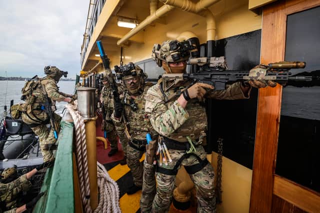 Royal Marines Commandos boarding the ferry in Sydney Harbour.