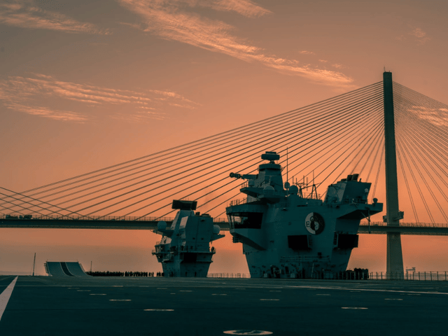 HMS Queen Elizabeth sailing under the Forth Bridges in Scotland as she reaches the final leg of her journey to Rosyth. She left Portsmouth for the second half of her maintenance period, with mechanical "issues" being discovered on the ship.