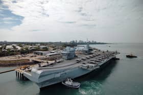 A historic defence trade agreement has been signed between the UK and Australia worth up to £20bn, in the backdrop of HMS Prince of Wales becoming the first Royal Navy carrier to visit Darwin this century.