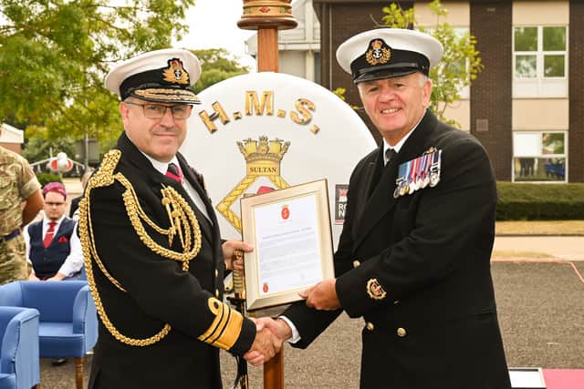 Vice Admiral Marshall presents the Gold Valedictory award to WO2 Pritchard