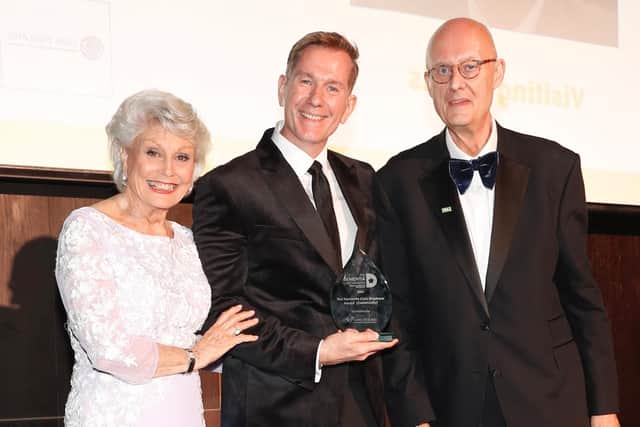 Visiting Angels boss Dan Archer, centre,  with Angela Rippon and Professor Martin Green, Chief Executive of Care England, who presented him with the Dementia Employer (Community) of the Year trophy at the 2025 Dementia Care Awards