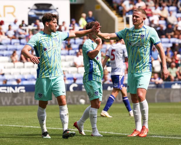 Callum Lang (left) celebrates scoring for Pompey in this afternoon's 4-0 success at Reading. Picture: Paul Phelan/ProSportsImages