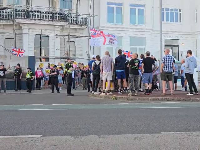 Protesters face off outside the Royal Beach Hotel