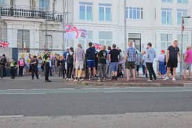 Protesters face off outside the Royal Beach Hotel