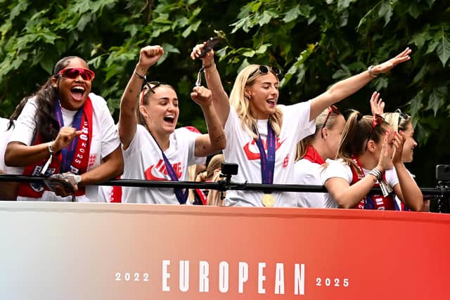 Khiara Keating, Georgia Stanway, Chloe Kelly and Ella Toone of England acknowledge the fans during the England Women's team victory parade and celebration on July 29, 2025 in London, England.