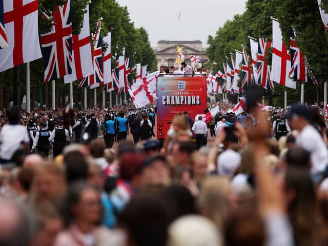 The England bus makes its way down The Mall during the England Women's team victory parade and celebration on July 29, 2025 in London, England.