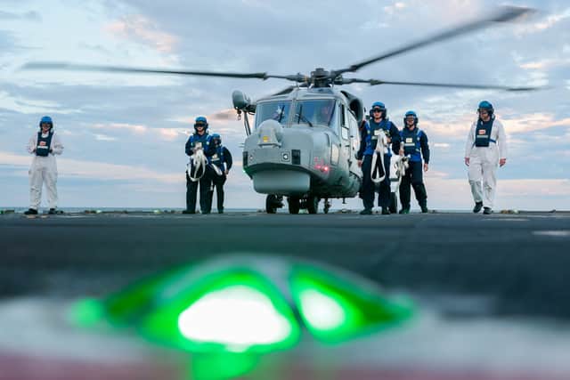 FOST Staff ensure the flight deck crew are swept up on aviation procedures during HMS Trent's flying trials.