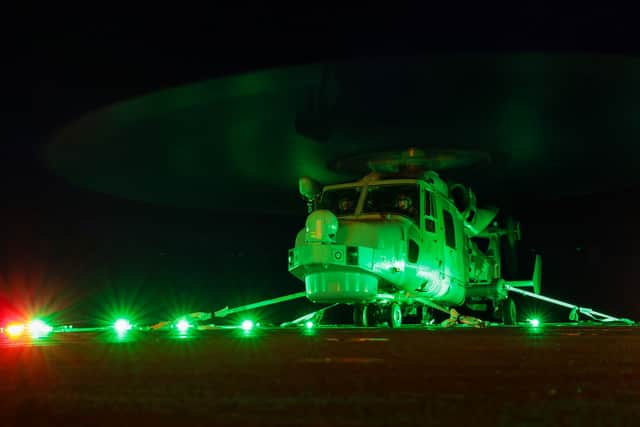 HMS Trent conducts night flying operations while testing new lighting systems.