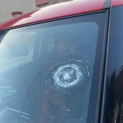 A windscreen damaged by rocks thrown at car from A3 bridge