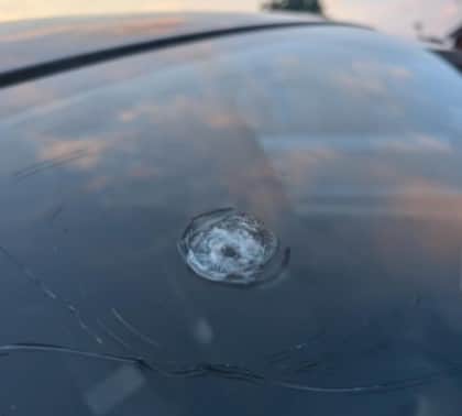 A windscreen damaged by rocks thrown from bridge on A£