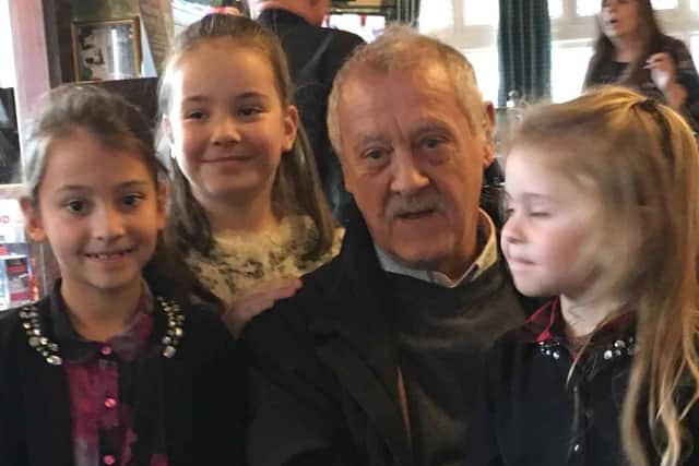 A family has launched a fundraiser to get him home from Thailand after a mass on his spine has left him paralysed.
Pictured: Robin with three of his grandchildren