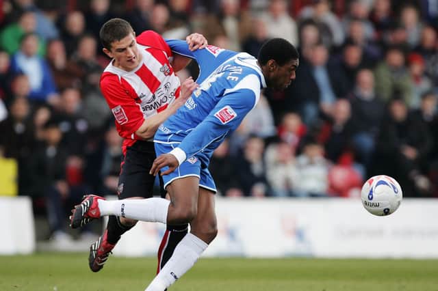 John Mousinho, representing Brentford, tangles with Oldham's Craig Rocastle in March 2007. Picture: Christopher Lee/Getty Images