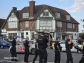 Police try to calm the situation down.