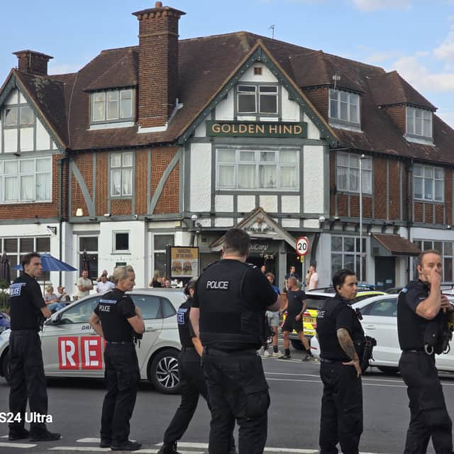 Police try to calm the situation down.