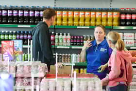 Staff welcome customers through the doors for the first time.