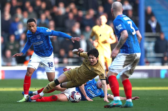 Yang Min-hyeok on the receiving end of a Regan Poole tackle while on loan at QPR last season. Picture: Peter Nicholls/Getty Images