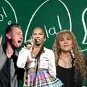 Who from the English-speaking world of music has been helping those non-English speakers pick up the subtle nuances of the language, and who has made it completely complicated?