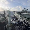 HMS Prince of Wales seen from RFA Tidespring whilst conducting a Replenishment at Sea. The Royal Navy flagship was resupplied in the Philippine Sea ahead of the UK Carrier Strike Group sailing to Japan.